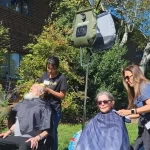 Volunteers Set Up Mobile Hair Salon and Bring a Sense of Normalcy